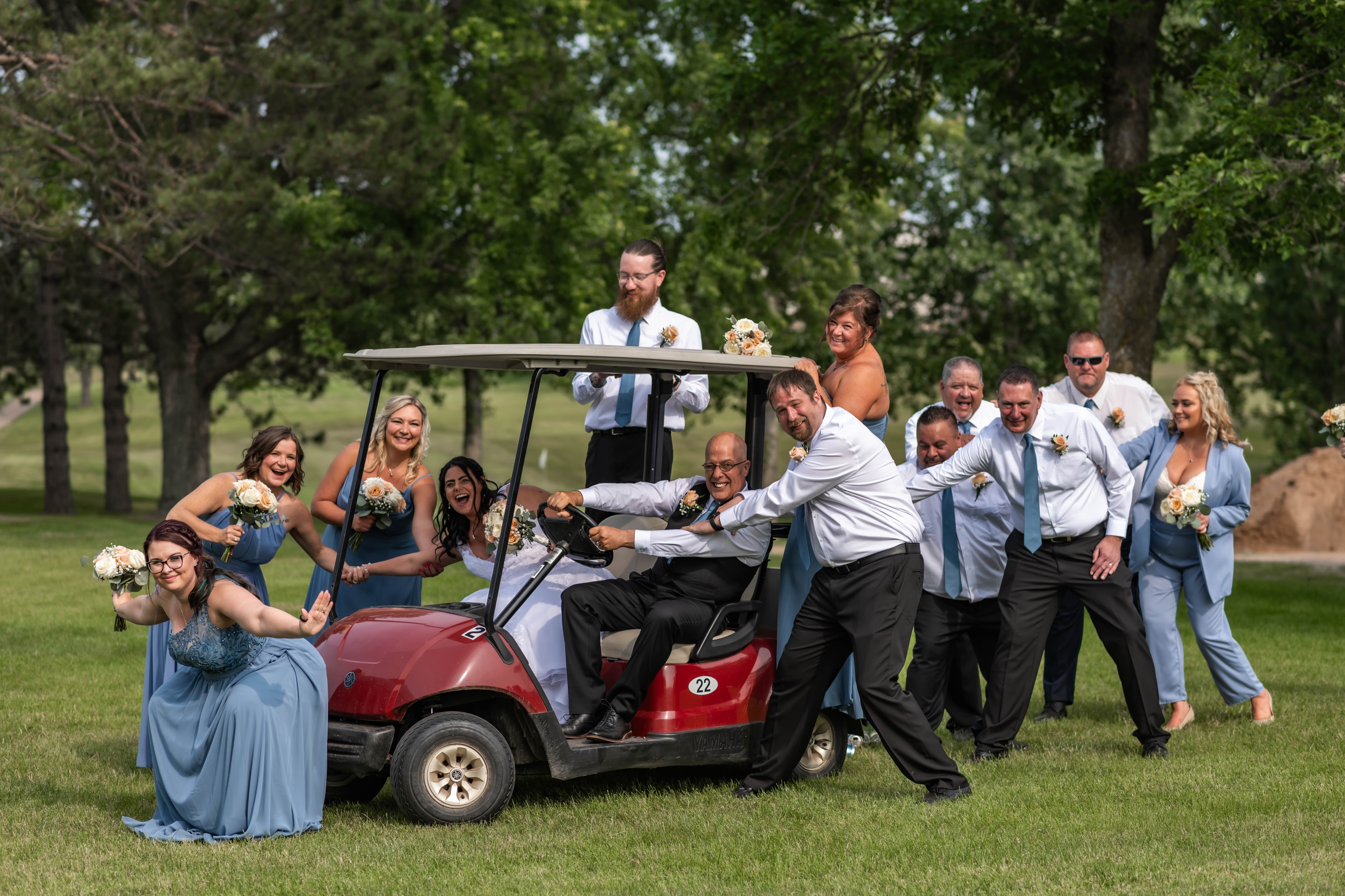 Wedding party celebrating on the golf course