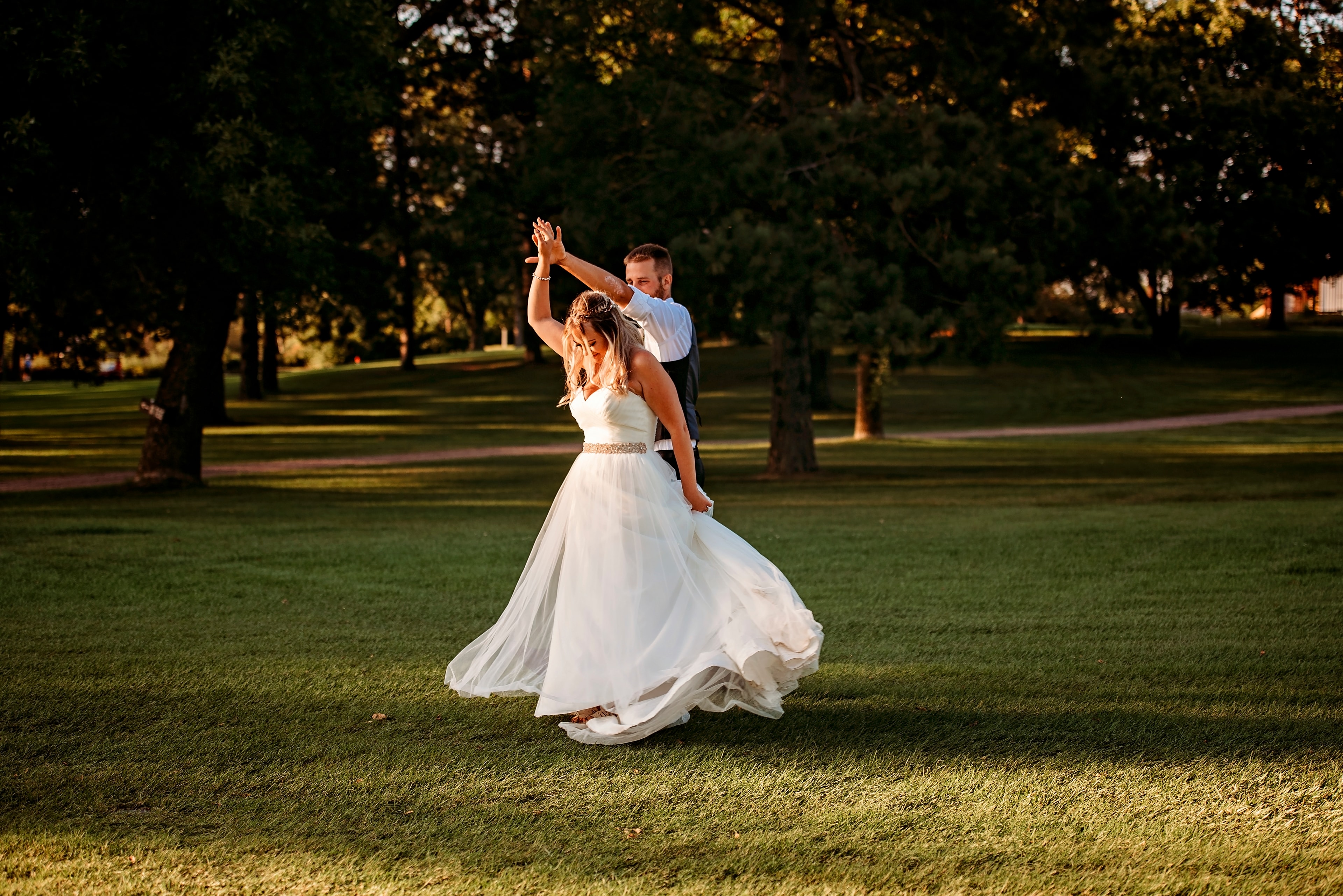 Bride and groom dancing on the fairway